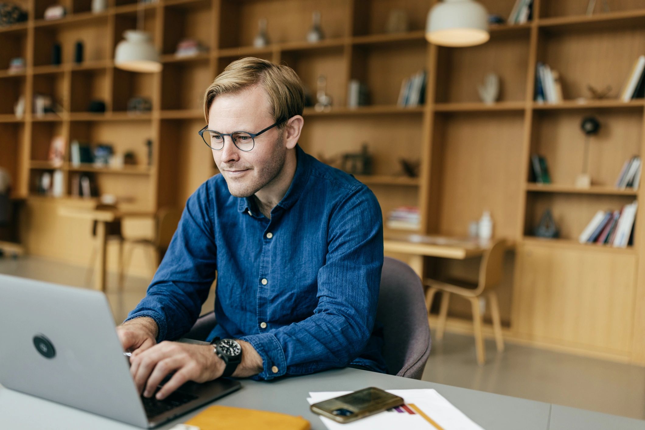 Professionals collaborating with laptop and analytics tools