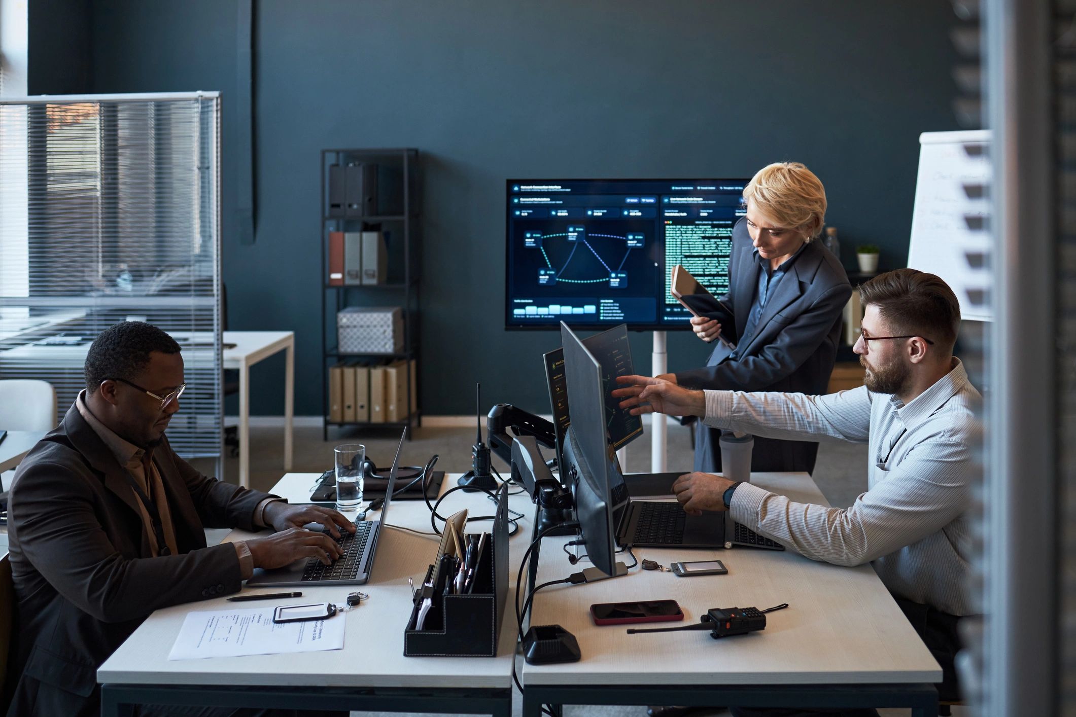 Business team reviewing performance dashboards in a modern office